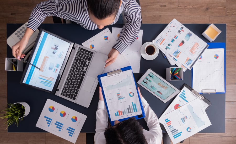 Top viewTop view of manager and employee doing teamwork in business office
